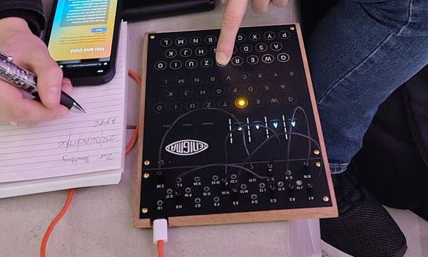Someone uses an enigma machine while making notes